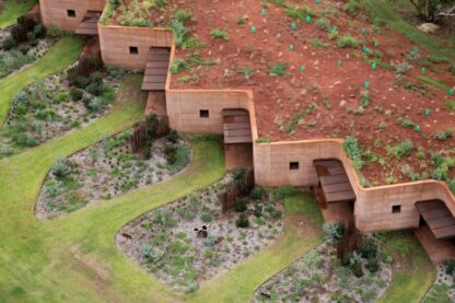 1-rammed-earth-wall-creates-thermal-mass-semi-buried-houses.jpg